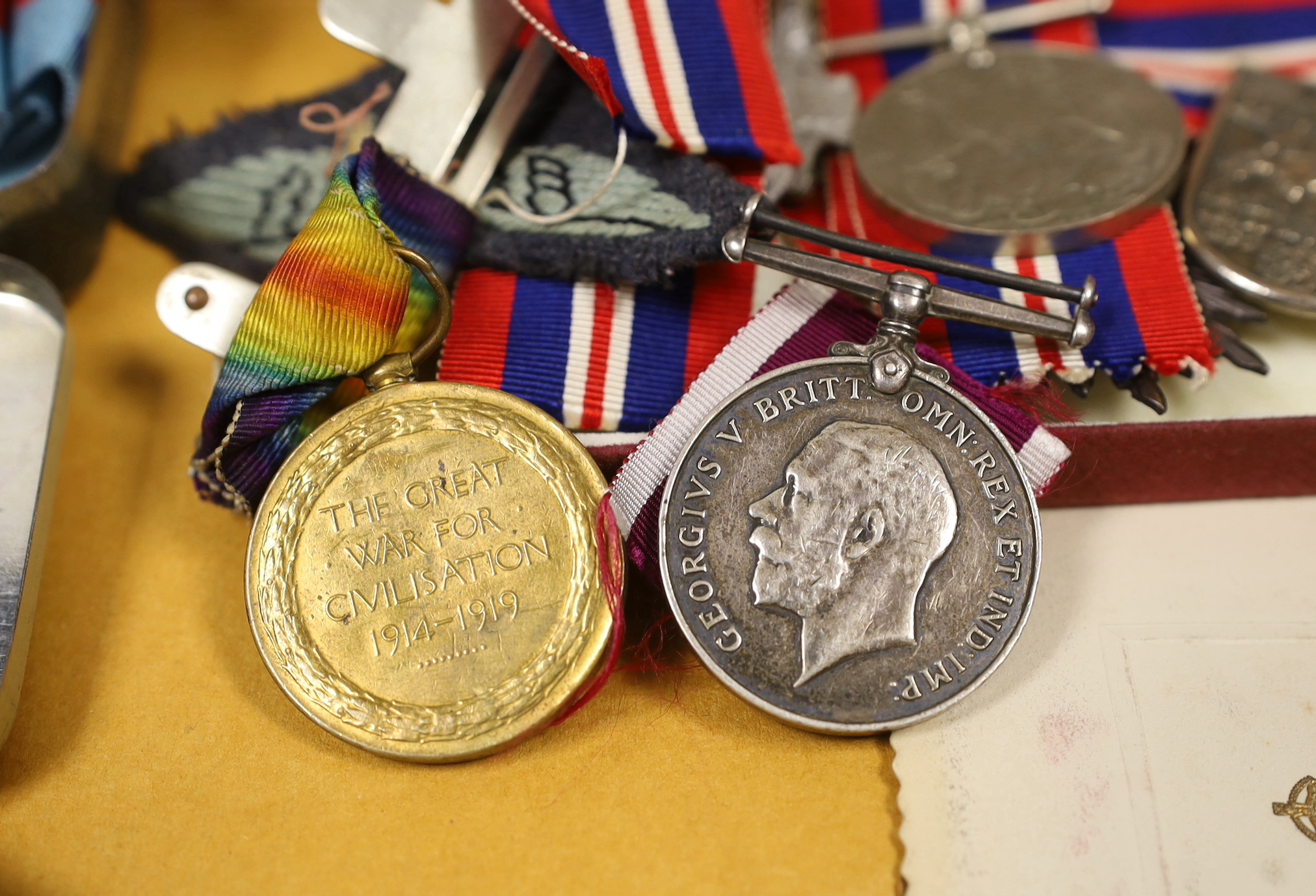 A WWI medal awarded to 990 PTE. F. GROCUTT. S. STAFF. R. together with other various medals, badges, paperwork, a bayonet etc.